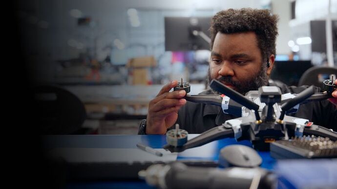 A Performance Drone Works employee works on a drone at the company’s manufacturing facility.